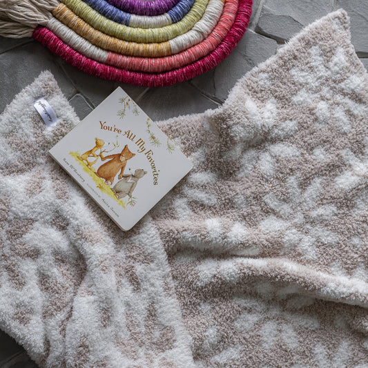 Couverture pour tout-petit à imprimé marguerites beige rosé et blanc