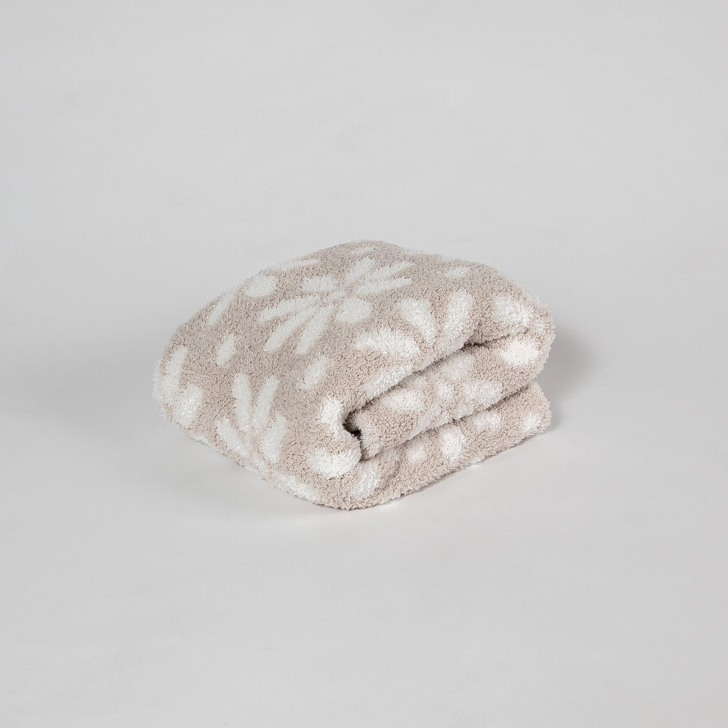 Couverture pour tout-petit à imprimé marguerites beige rosé et blanc
